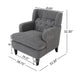 Giga upholstered tufted armchair with plush fabric and wooden legs, perfect for living room or bedroom decor.