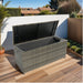 Giga outdoor wicker storage box with lid, patio deck cabinet for cushions, toys, pillows, and towels in a garden setting.