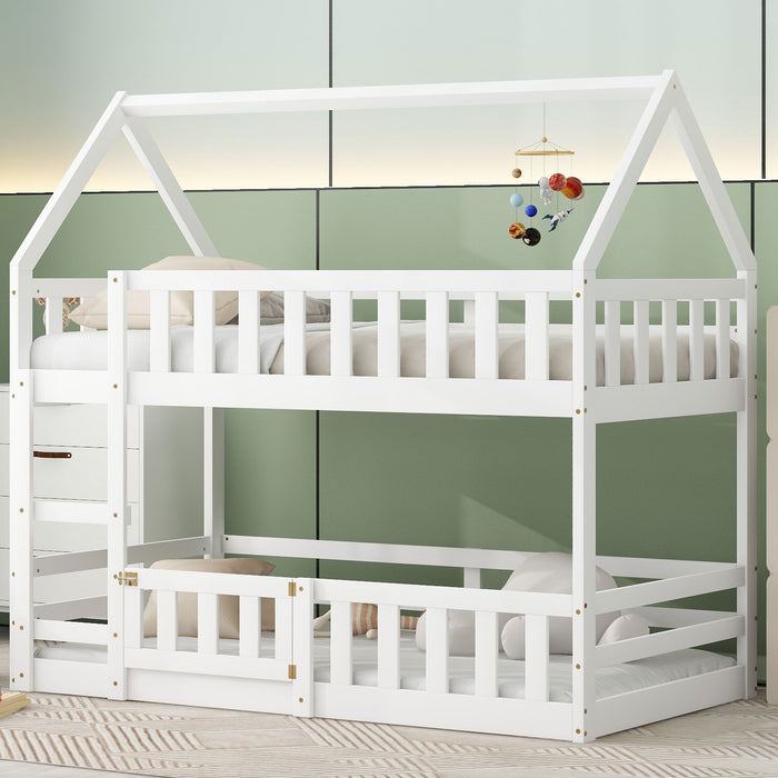 Giga twin over twin house bunk bed with safety fence and door, featuring a cozy design and sturdy wood construction.