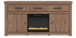 Signature Design by Ashley Garistyn TV stand with built-in fireplace, wood finish, and storage cabinets for modern living rooms.