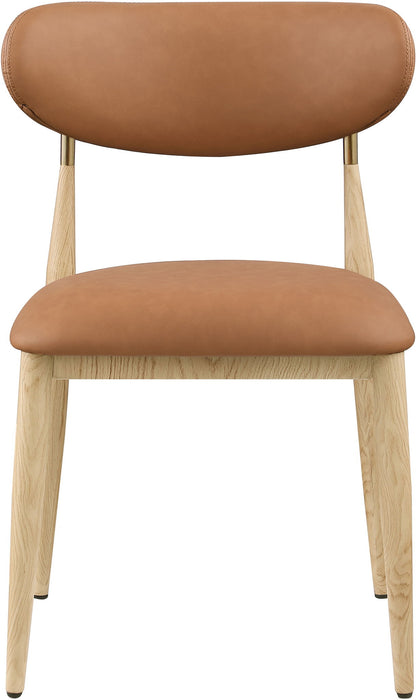Vegan leather upholstered Meridian Furniture Ronda dining side chair with natural wooden legs, modern design and comfortable seating.