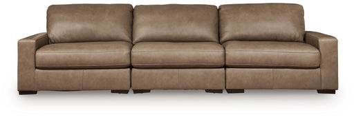 Benchcraft Veronella 3-piece stationary sectional sofa with plush cushions and modern design, shown in a cozy living room setup.