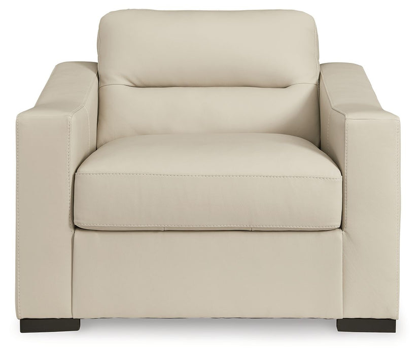Signature Design by Ashley Treasure Trove 2-piece chair and ottoman set in almond, stationary chair with matching ottoman for living room.