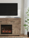 Signature Design by Ashley Garistyn TV stand with built-in fireplace, featuring wood finish and modern storage compartments.