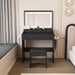 Modern Giga makeup vanity set with adjustable lighting, power outlet, and hair dryer holder, featuring sleek design and mirror.
