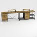 Giga industrial L-shaped brown corner desk with power hub, six drawers, and adjustable monitor stands for ergonomic workspace.