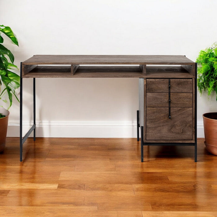 Medium brown wooden writing desk with three drawers and open shelves from HomeRoots, showcasing a sleek, functional workspace.