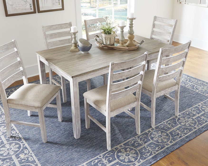 White 7-piece Skempton dining room table set by Ashley Furniture featuring a large rectangular table and six matching chairs.
