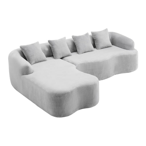 Giga modular L-shape sectional sofa with curved chaise, stationary design, featuring plush cushions and modern upholstery.