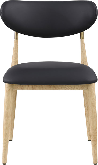 Vegan leather upholstered dining side chair with natural wood legs by Meridian Furniture, featuring a comfortable, modern design.
