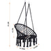 Giga macrame hanging hammock chair with rope design, suitable for indoor and outdoor use, perfect for relaxing or lounging.