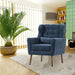 Giga modern upholstered accent armchair with soft padding, wooden legs, and a pillow, ideal for living room or bedroom seating.