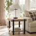 Signature Design by Ashley Jorannti living room end table with wooden top and metal legs, modern style, close-up view.