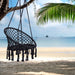 Giga macrame hanging hammock chair with rope swing design for indoor or outdoor use, featuring woven texture and sturdy support.