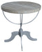 Reclaimed wood and iron round pedestal end table in brown, featuring a rustic design and sturdy construction.