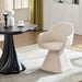 Beige 180° rotating Giga accent swivel chair with cushioned seat and backrest for living room comfort and style.
