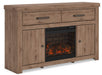 Signature Design by Ashley Garistyn TV stand with fireplace option, featuring wood finish and modern storage compartments.