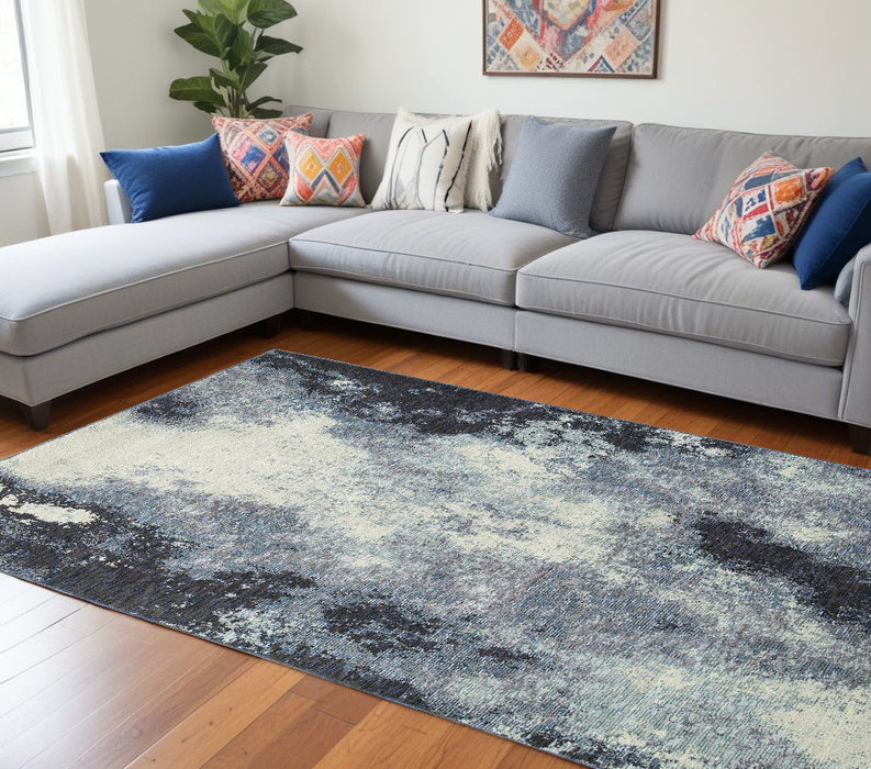 6.6' x 9.8' Abstract Power Loom Area Rug - Blue And Ivory