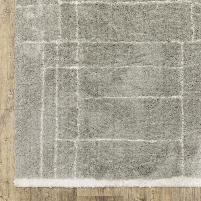 7.9' x 10.8' Geometric Shag Power Loom Stain Resistant Area Rug - Grey And Ivory