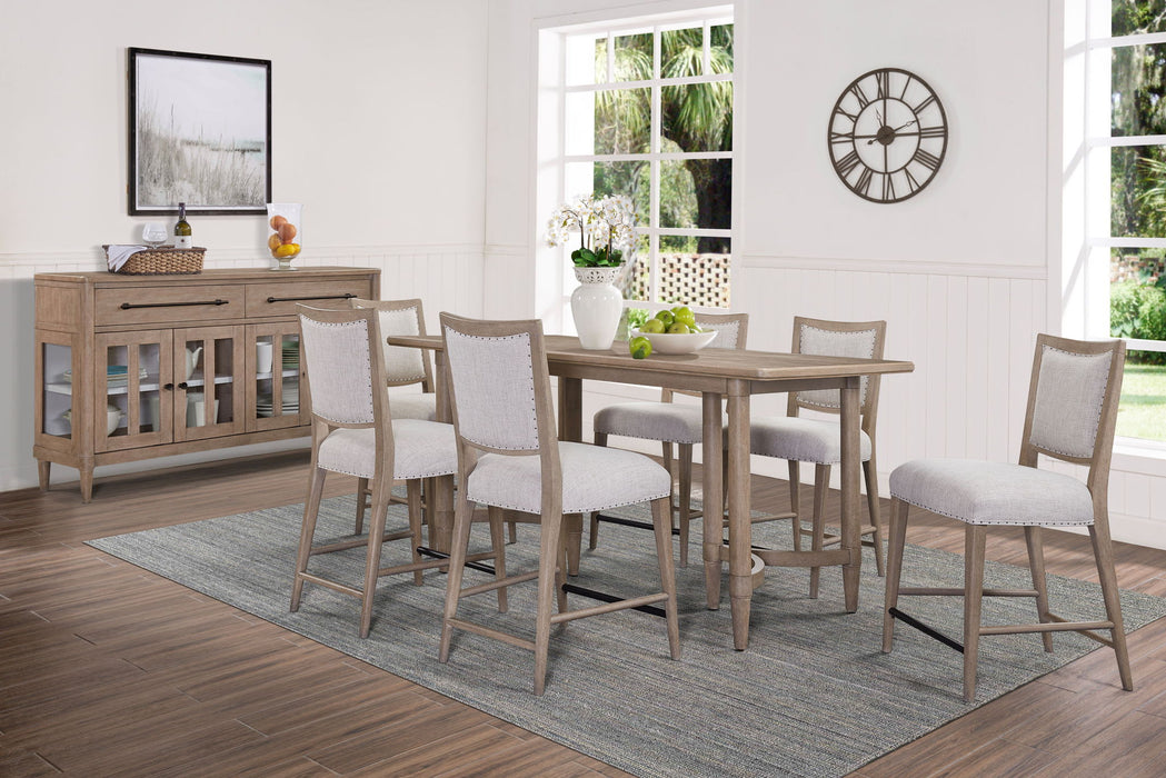 Sand-colored Bernards Furniture counter height dining table with a smooth surface and sturdy wooden legs.