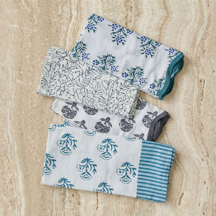 Set of four TOV Furniture Crissy cotton canvas printed napkins with blue vintage floral pattern for dining and table decor.