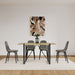 Set of four Giga modern accent dining chairs with upholstered seats and metal legs, showcasing stylish and comfortable seating.