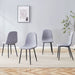 Set of four Giga luxury linen and cotton dining chairs with black metal legs in light gray, showcasing a modern, simple design.