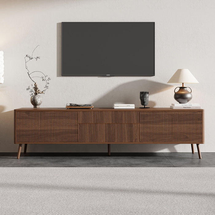 Walnut fluted TV stand with storage drawers and cabinets, soft-close hinges, cable management for TVs up to 80 inches, by Giga.