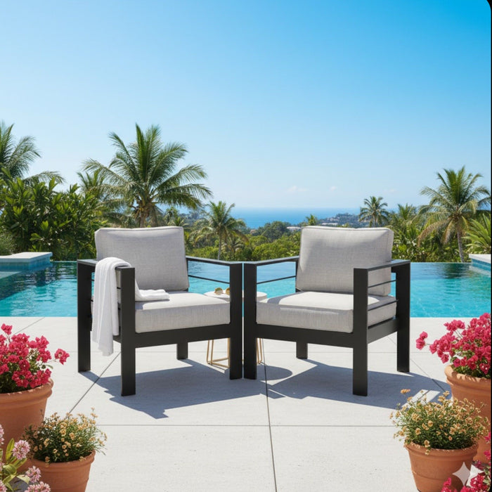 Set of two Giga modern all-weather patio armchairs with thick cushions, designed for outdoor comfort and style.