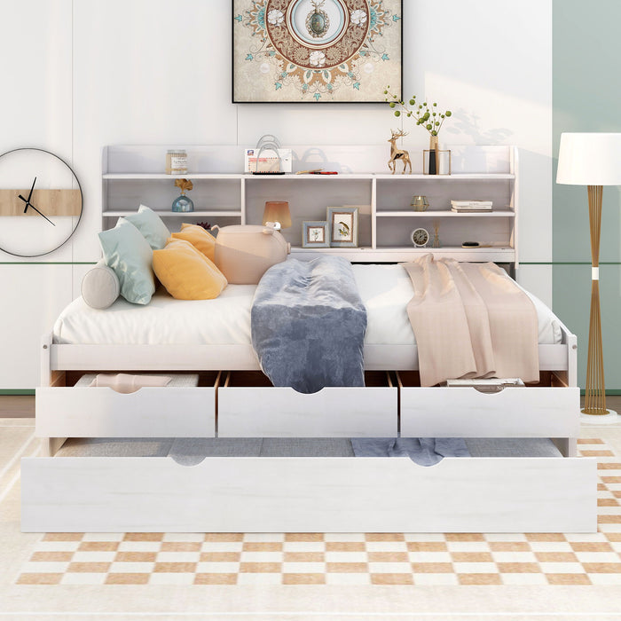 Giga Captain Bed with built-in bookshelves, three storage drawers, and a trundle for extra sleeping space, in a modern bedroom.