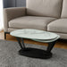 HomeRoots 36-inch faux marble and metal oval coffee table with white and black finish, modern living room furniture piece