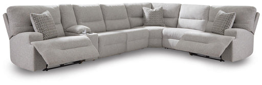 Signature Design by Ashley Acklen Place 7-piece reclining sectional with plush cushions and modern fabric in a spacious living room setting.