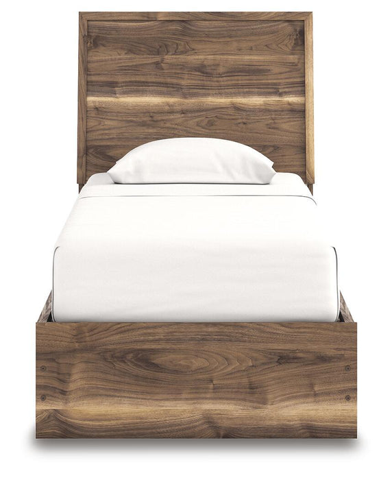Signature Design by Ashley Chirason panel bed with built-in storage drawers in a modern bedroom setting.