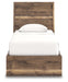 Signature Design by Ashley Chirason panel bed with built-in storage drawers in a modern bedroom setting.