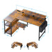 Black and brown L-shaped Giga gaming desk with power outlets, monitor stand, and storage shelves in a reversible corner workstation design.