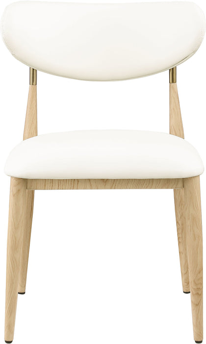 Vegan leather upholstered dining side chair with natural wooden legs, by Meridian Furniture, showcasing a modern, comfortable design.