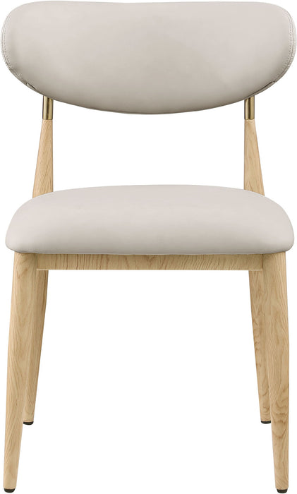 Vegan leather upholstered dining side chair with natural wooden legs by Meridian Furniture, showcasing a modern, stylish design.