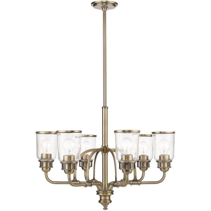 Six-light metal chandelier with shades in antiqued brass finish, featuring clear glass shades, by HomeRoots.