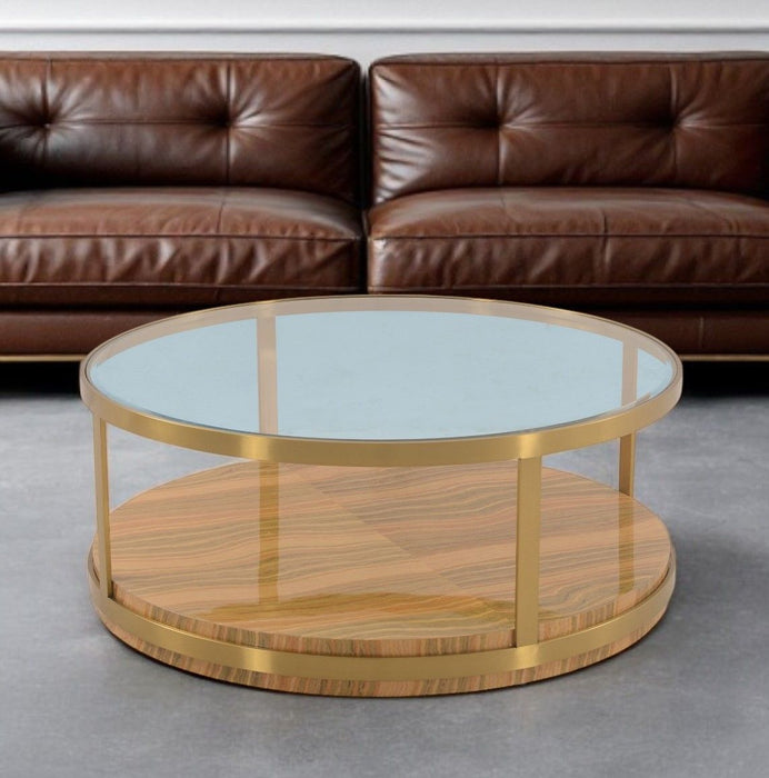 Glass wood and metal round coffee table with shelf in clear, gold, and brown finishes by HomeRoots.