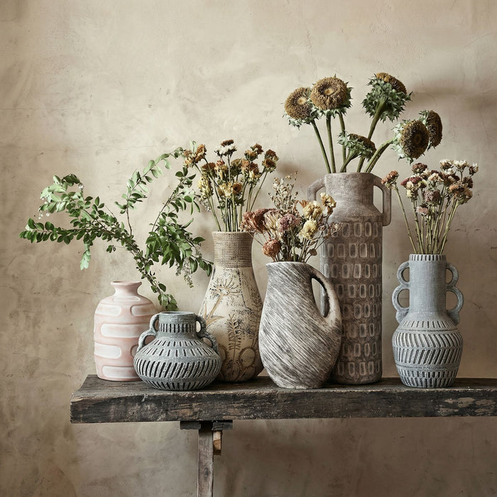 Gray earthenware vase with a floral pattern, designed by TOV Furniture, perfect for decorative vases and home accents.