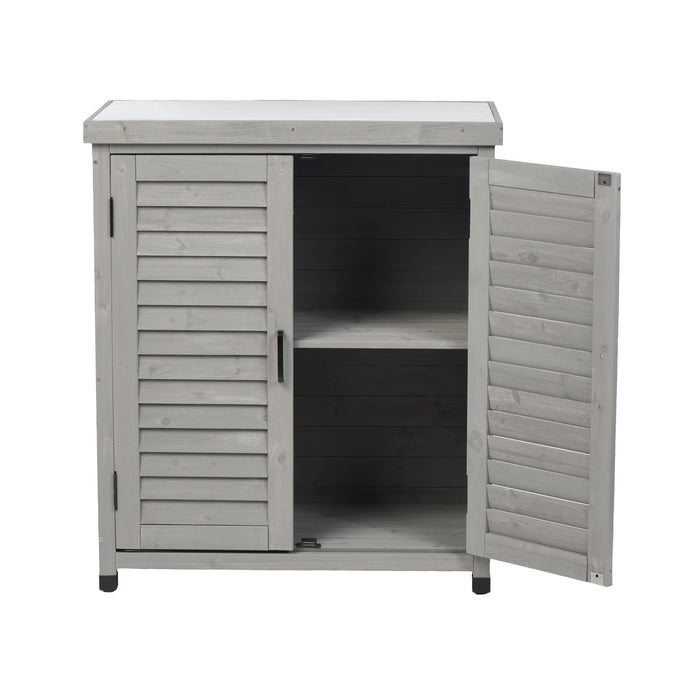 Giga potting bench with storage cabinet and metal tabletop for outdoor gardening, shown with gardening tools and potted plants