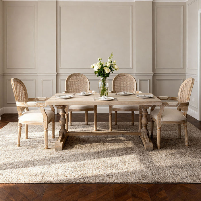 Set of two Giga French vintage beige upholstered fabric dining armchairs with elegant armrests and wooden legs.