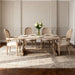 Set of two Giga French vintage beige upholstered fabric dining armchairs with elegant armrests and wooden legs.