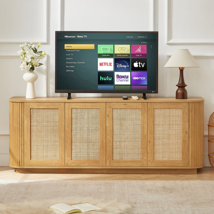 Contemporary wave-shaped Giga TV stand with rattan doors, modern design, and open shelving for media storage.