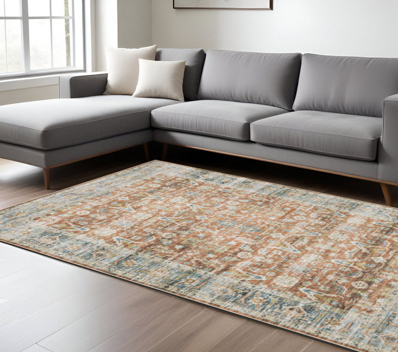 7' x 10' Oriental Printed Stain Resistant Non Skid Area Rug - Rust Blue Ivory And Gold
