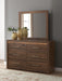 Signature Design by Ashley Janfyn six-drawer dresser with dark wood finish and sleek metal handles, showcasing ample storage space.