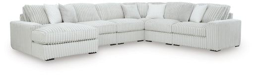 Signature Design by Ashley stupendous 6-piece stationary sectional with plush cushions and modern design in a cozy living room setting.