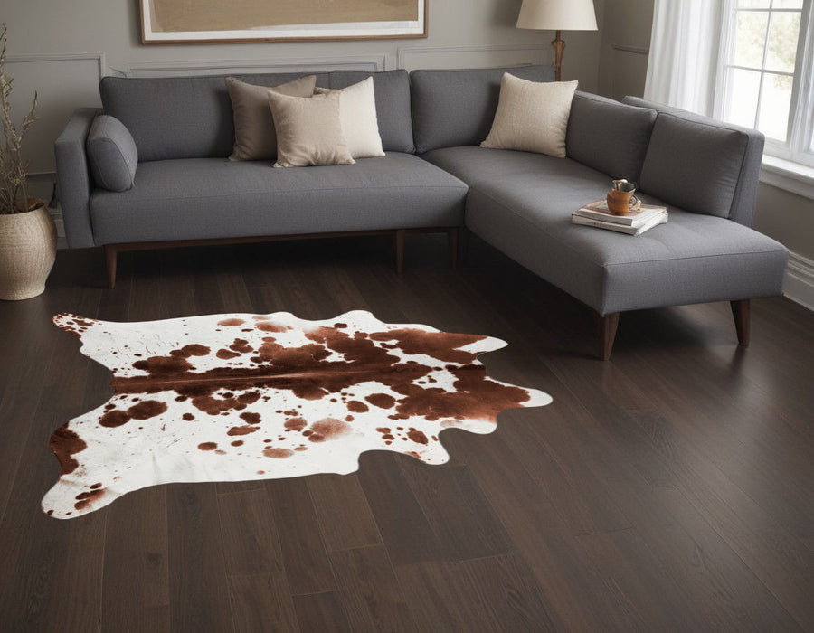 5' X 7' Spotted Natural Cowhide Area Rug - Brown And White