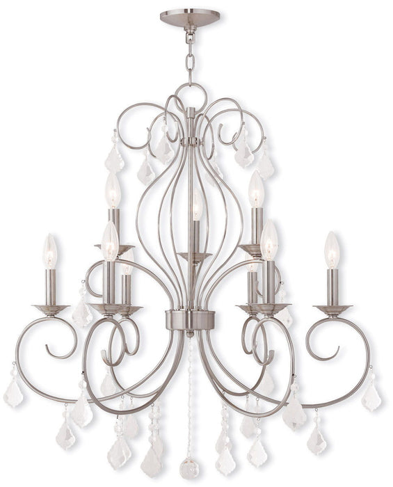 Nine light metal chandelier with shades in nickel finish and clear glass, dimmable HomeRoots chandelier for elegant lighting.