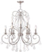 Nine light metal chandelier with shades in nickel finish and clear glass, dimmable HomeRoots chandelier for elegant lighting.